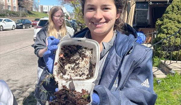 Student participates in a spring clean up event