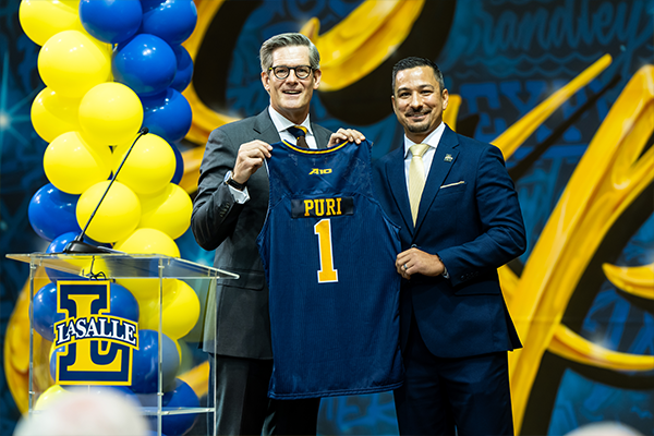 President Dan Allen, Ph.D., (left) and Vice President of Athletics & Recreation and Director of Athletics Ashwin “Ash” Puri (right) pose for a photo during the introduction event.