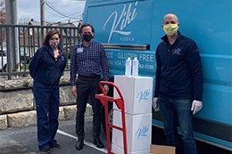 People loading a Kiki Vodka van