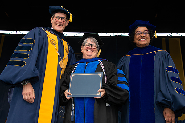 Professor Tait receiving the award alongside President Allen and Provost and Vice President of Academic Affairs, Shivanthi Anandan, Ph.D.