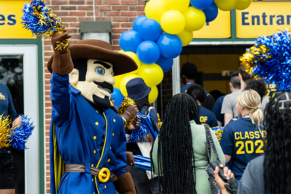 Image of the Explorer acting cheerfully during Move-In Weekend. 