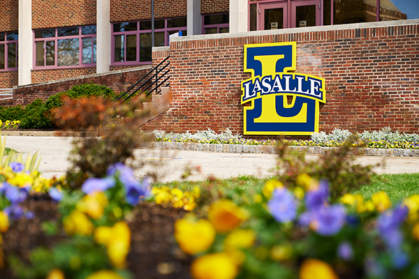 Image of the La Salle "L" outside of Lawrence Administrative Building.
