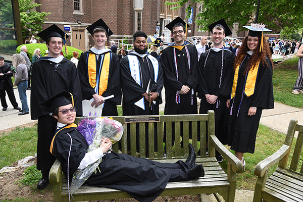Image of graduates posing for a photo. 