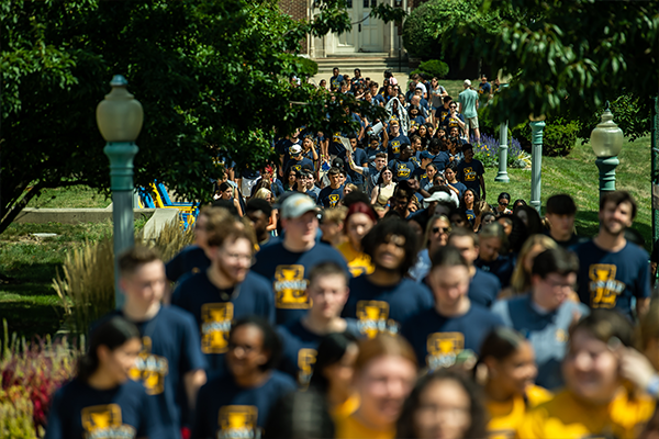 A group of La Salle students walking across campus.