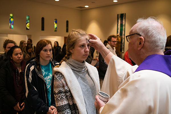 Distribution of ashes at De La Salle Chapel on Ash Wednesday 2019.