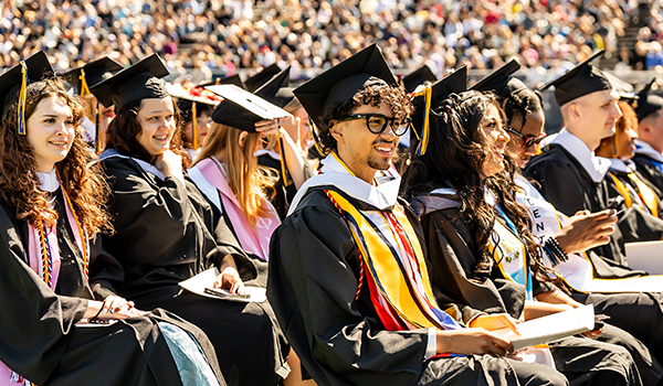 Undergraduate commencement speaker and school mascot Alexis Sanchez