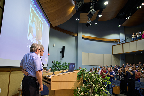 Joe and Joanne Kitchen receive a standing ovation from colleagues in Founders’ Hall Auditorium during a university-wide meeting in late August, when the Kitchens were announced as 2023 Distinguished Lasallian Educator Award recipients.