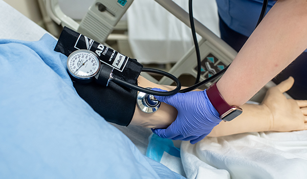 Image of a student working in the nursing simulation labs.