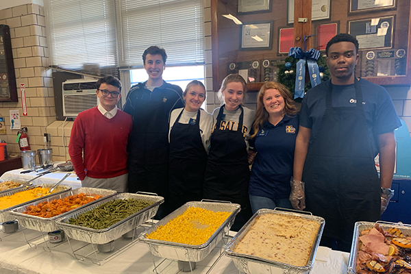 Students serving food for the Philadelphia Police. 