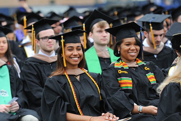 Image of students wearing cap and gowns during Commencement.