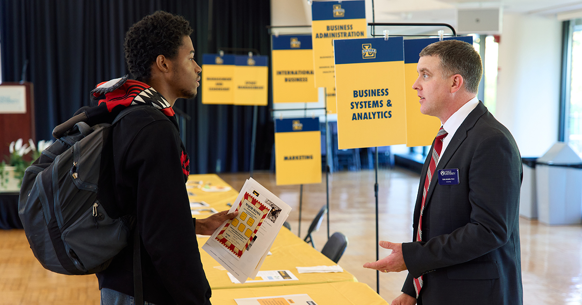 La Salle student and faculty at Major Ma...