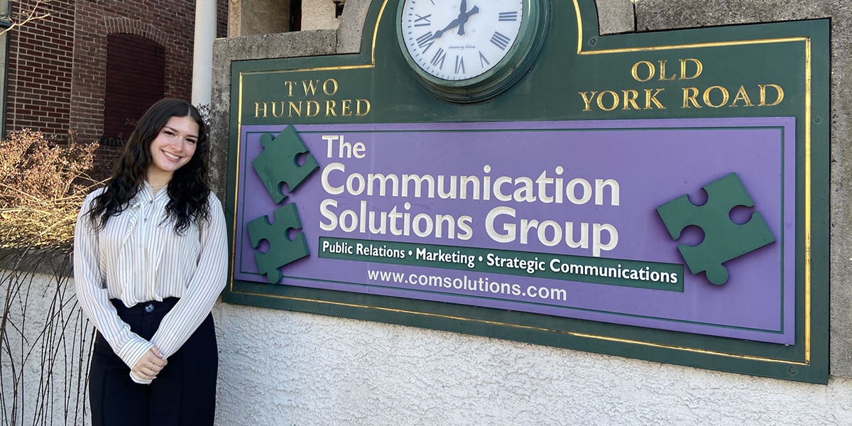 Marissa Castro standing in front of her internship site.