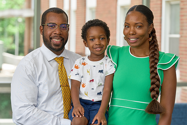 From left to right: Caleb Foy, MSN ’23, with his son Caleb Jr. and wife Gracie.