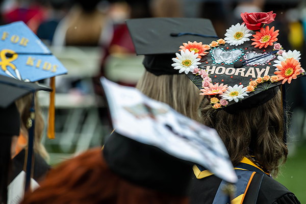 Image of a decorated graduation cap that says, "Hooray!"